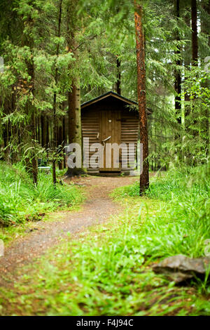 An outhouse in the forest, Finland. Stock Photo