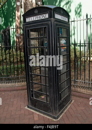 Typical black telephone box in London. England. Great Britain. Stock Photo