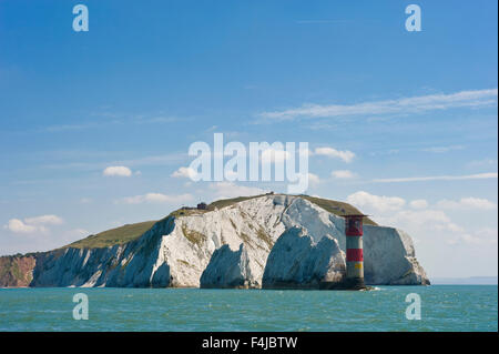 The Needles is a row of three distinct stacks of chalk that rise out of the sea off the western extremity of the Isle of Wight. Stock Photo