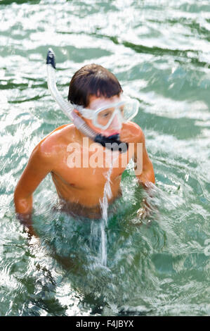 Boy swimming with a cyclops, Sweden. Stock Photo