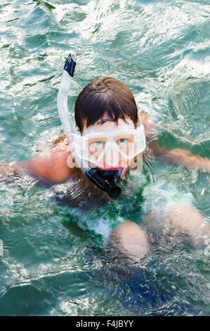 Boy swimming with a cyclops, Sweden. Stock Photo