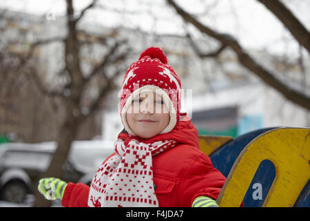 Adorable little boy in winter park Stock Photo