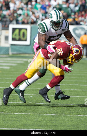 New York Jets' David Harris, Right, Stretches With Teammates During The 