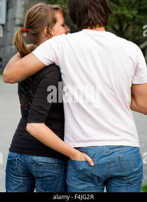 Young couple with womans hand in mans pocket Stock Photo