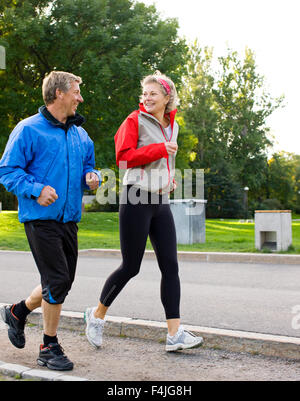 Mature couple jogging together Stock Photo