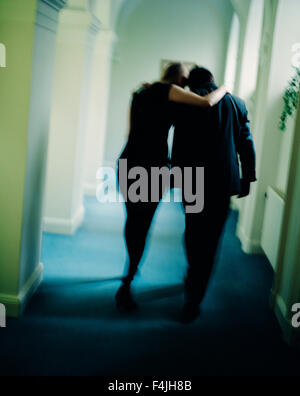 Sweden, Stockholm, couple walking in corridor Stock Photo