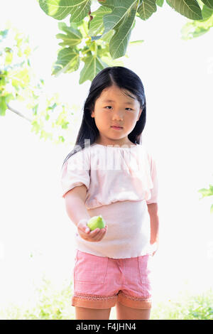 Italy, girl with fresh fig Stock Photo