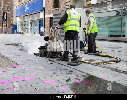 Southport, Merseyside, UK 19th October, 2015.  Launch of Keep Britain Tidy Campaign. Trial of street chewing gum removal machine in Southport operated by Primoserve Environmental Ltd in advance of the launch of the latest Keep Britain Tidy campaign on the 20th October.  The particular machine, one of only three in the country, uses high temperature steam to remove and loosen the gum which is then transferred to an adjacent trailer.  The discarded street pavement gum, to be targeted, is highlighted with a magenta fluorescent spray. Stock Photo