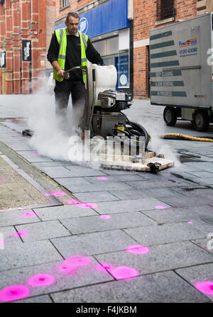 Southport, Merseyside, UK 19th October, 2015.  Launch of Keep Britain Tidy Campaign. Trial of street chewing gum removal machine in Southport operated by Primoserve Environmental Ltd in advance of the launch of the latest Keep Britain Tidy campaign on the 20th October.  The particular machine, one of only three in the country, uses high temperature steam to remove and loosen the gum which is then transferred to an adjacent trailer.  The discarded street pavement gum, to be targeted, is highlighted with a magenta fluorescent spray. Stock Photo