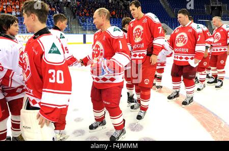 Russian President Vladimir Putin congratulates student players following an ice hockey match with the Legends team in a match against the students of the Sirius Center for Gifted Children September 1, 2015 in Sochi, Russia. Stock Photo