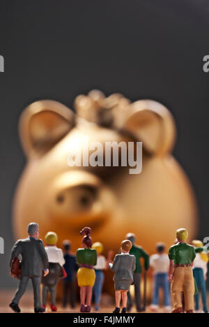 Piggy bank and crowd Stock Photo