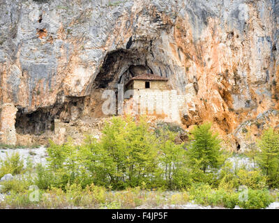 The hermitage cave and church at lake Megali Prespa Macedonia, Greece Stock Photo