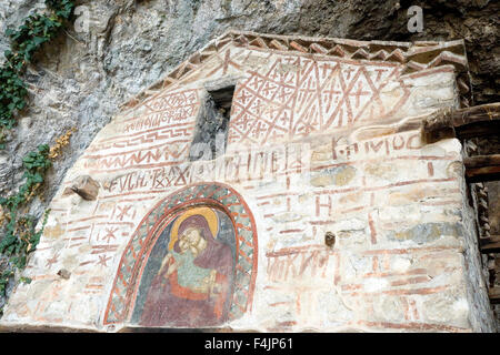 The hermitage cave and church at lake Megali Prespa Macedonia, Greece Virgin of Tenderness icon Stock Photo