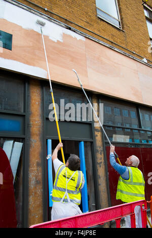 Southport, Merseyside, UK 19th October, 2015. Painting the finishing touches to New Costa Coffee, shop front refurbishment to open in town. UK coffee chain, Costa, has announced plans to significantly expand its estate on the back of strong sales growth.  New store, shop, cafe opening, The Whitbread owned business plans to grow its UK store base to around 2,500 in 2020, up from 1,931. Costa’s UK sales rose 16.2% in the last year, for instance, with 4.6% growth in transactions per store. Stock Photo