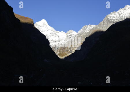 Neelkanth mountain peak covered by heavy snow, Badrinath with first sunlight in  early morning and clear blue sky August Uttarak Stock Photo