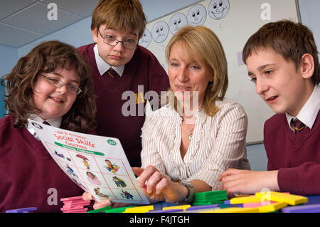 Teacher Annette Box teaching autistic students at Hanham High School, Bristol. Stock Photo