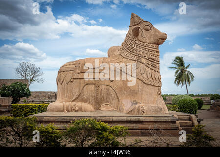 Huge Nandi bull at the entrance of the ancient Shiva temple Hindu temple in Tamil Nadu, India Stock Photo