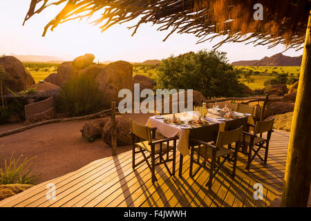 Table set for dinner at the Twyfelfontein Country Lodge, Namibia, Africa Stock Photo