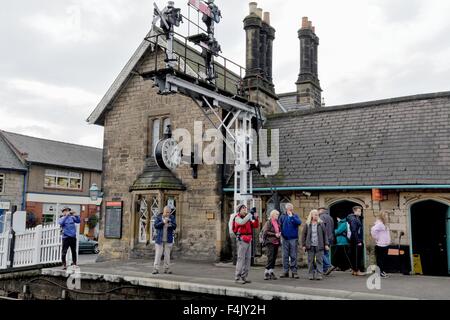 Steam train enthusiasts on Grosmont station North Yorkshire UK Stock Photo