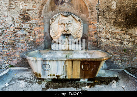 Rome, Italy - August 6, 2015: Fountain of the Basilica of Saint Sabina, church on the Aventine Hill in Rome, Italy Stock Photo