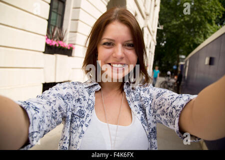 young woman taking a selfie Stock Photo