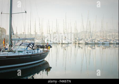 Marina de Lagos, Lagos, Algarve, Portugal, 2015-10-16. Boats moored during a dense fog in the marina. Stock Photo