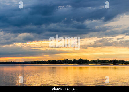 Sunset with dramatic sky over Nove Mlyny lake, Mikulov, Czech Republic Stock Photo