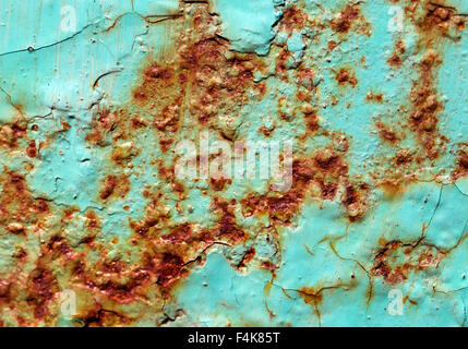 Close-up of peeling paint and rust on a wall Stock Photo