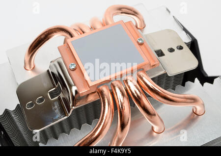 Pre-applied MX-2 thermal compound and copper heat pipes on the underside of an Arctic Cooling Freezer Xtreme CPU cooler. Stock Photo