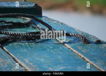 Rope on deck of small fishing boat on Tonle Sap River, Cambodia Stock Photo