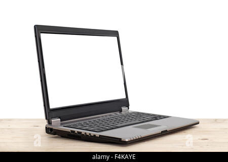 laptop with blank screen on wooden table isolated on white background Stock Photo