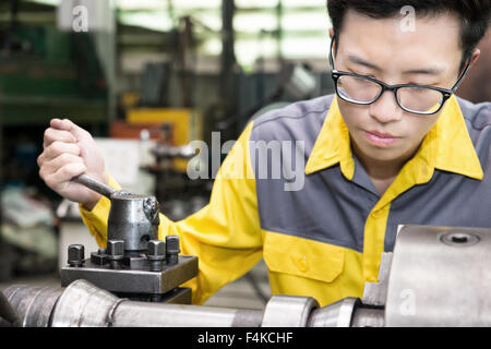 Mechanical Engineering control lathe machine in factory Stock Photo