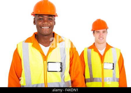 happy African blue collar worker with colleague on background Stock Photo