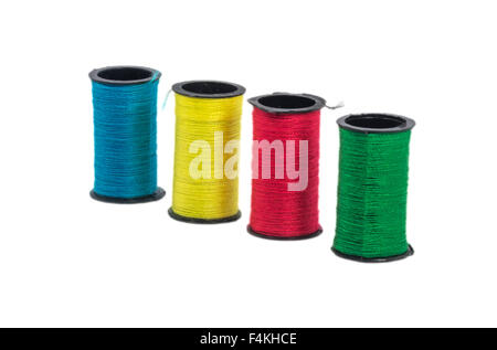 Multi color sewing thread with isolated white background Stock Photo