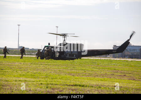 Trapani, Italy. 19th Oct, 2015. Military getting inside the helicopter during the NATO Trident Juncture 2015 opening. It is a major land, sea and air exercise in the Mediterranean as part of military modernization at Trapani. © Antonio Melita/Pacific Press/Alamy Live News Stock Photo