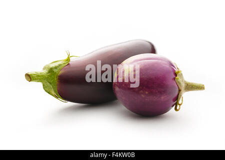 Two young eggplants on a white background Stock Photo