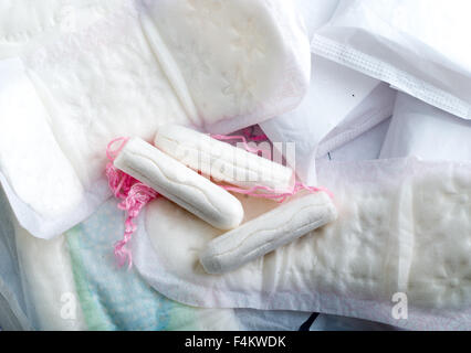 Sanitary pads and tampons isolated on white background Stock Photo - Alamy