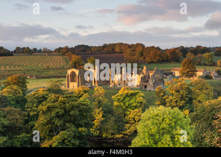 Egglestone Abbey, Barnard Castle, Teesdale, County Durham.  Tuesday 20th October 2015, UK Weather.  It was a calm start to the day in Teesdale as the first rays of the rising sun illuminated the ruins of Egglestone Abbey.  However heavy rain and strong winds are expected to spread in from the west this evening. Credit:  David Forster/Alamy Live News Stock Photo