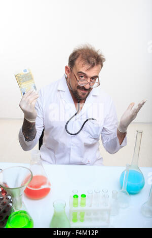 Mad chemist in the lab doing reaction Stock Photo
