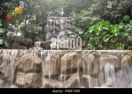 beautiful man-made waterfall in the park Stock Photo