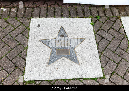 A star shaped plaque saying Murry Walker in the pavement at Broad Street walk of stars Birmingham West Midlands England UK Stock Photo