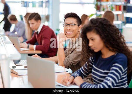 Group of a students studying in the university library Stock Photo