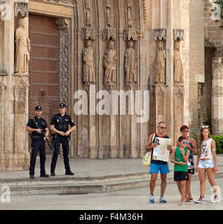 Armed National Police patrolling a tourist area, Valencia, Spain. Stock Photo