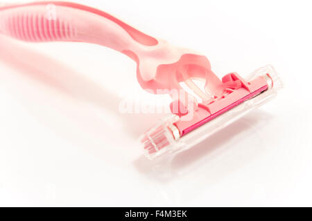 Pink razor isolated on white. Stock Photo