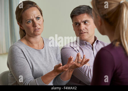 Couple Discussing Problems With Relationship Counsellor Stock Photo