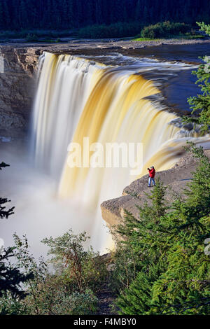 Alexandra Falls with photographer, human figure, Twin Falls Territorial Park, Northwest Territories, Canada Stock Photo