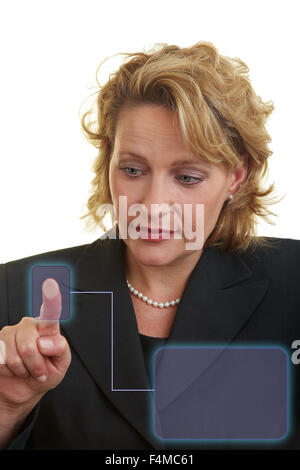 Business woman pressing her finger on a digital information sensor Stock Photo