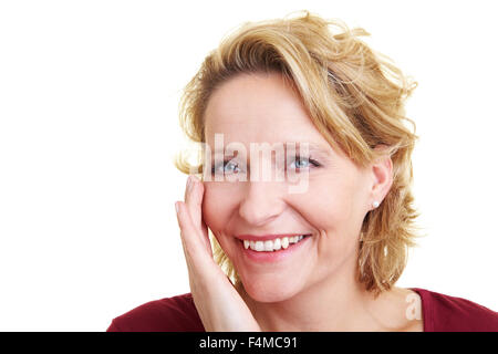 Happy woman touching her cheek with her hand Stock Photo