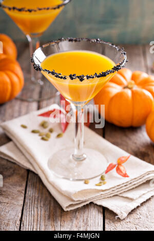 Pumpkintini pumpkin martini coctail with black salt rim for fall and ...