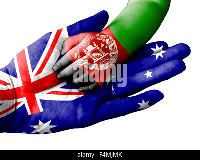 Flag of Australia overlaid the hand of an adult man holding a baby hand with the flag of Afghanistan overprinted Stock Photo